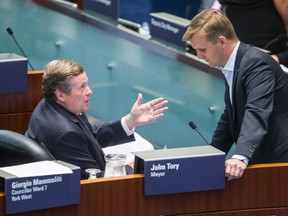 Toronto Mayor John Tory chats with Councillor Joe Cressy in Council Chambers at City Hall on Monday, Aug. 20, 2018.