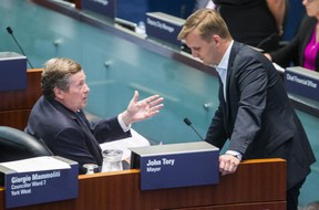 Toronto Mayor John Tory chats with Councillor Joe Cressy in Council Chambers at City Hall on Monday, Aug. 20, 2018.