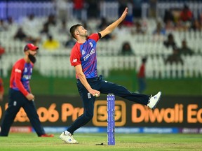 Mark Wood of England in bowling action during the ICC Men's T20 World Cup semifinal match.