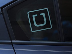 The Uber logo is seen on a car.