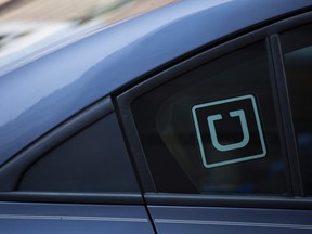The Uber logo is seen on a car.