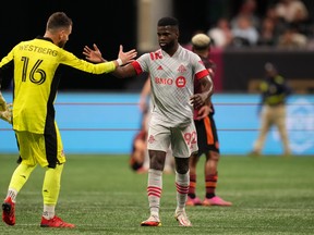 Toronto FC defender Kemar Lawrence (92) and goalkeeper Quentin Westberg celebrate after playing to a draw with Atlanta United FC.