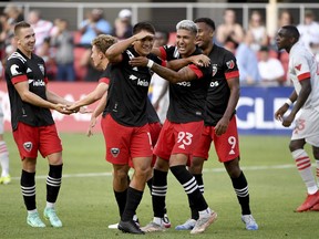 D.C. United's Yamil Asad (centre left) celebrates with teammates after scoring against Toronto FC earlier this season.