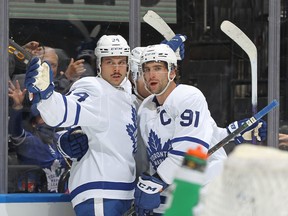 Auston Matthews (left) of the Toronto Maple Leafs celebrates a goal with teammate John Tavares against the Boston Bruins.