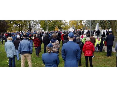 Royal Canadian Air Force personnel stand among the socially-distanced crowd during a Remembrance Day service Thursday, Nov. 11, 2021 in Belleville, Ont.