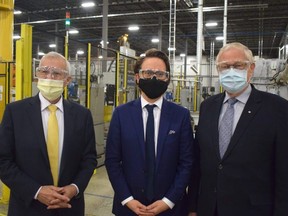 Todd Baker, president of ArcelorMittal Tailored Blanks, is flanked by MPPs Ernie Hardeman and Vic Fedeli at his Woodstock plant on Tuesday Nov. 23, 2021. (CALVI LEON, The London Free Press)