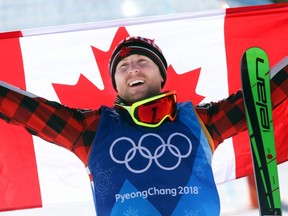 Brady Leman of Canada celebrates his gold medal in the men's ski cross final at the Phoenix Snow Park during the 2018 Winter Olympics in South Korea, on Feb. 21, 2018.