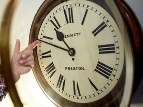 Duncan Clements of Pendulum of Mayfair antique clock specialists carries out the summertime adjustment of the clocks, regulators and timepieces in the display rooms on April 01, 2019 in London, England.