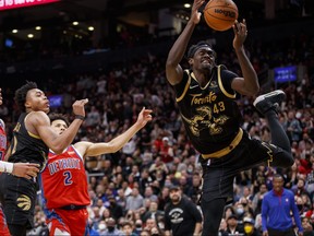 Pascal Siakam #43 of the Toronto Raptors grabs a loose ball as Killian Hayes #7 and Cade Cunningham #2 of the Detroit Pistons wrap up Scottie Barnes #4 of the Toronto Raptors during the second half of their NBA game at Scotiabank Arena.