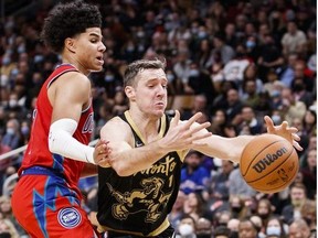 Goran Dragic of the Toronto Raptors fumbles the ball as Killian Hayes of the Detroit Pistons defends during the second half of their NBA game at Scotiabank Arena on November 13, 2021 in Toronto, Canada.