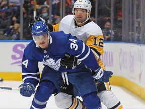 Zach Aston-Reese #12 of the Pittsburgh Penguins tries to tie up Auston Matthews #34 of the Toronto Maple Leafs last weekend.
