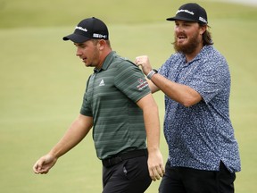 Lucas Herbert of Australia celebrates with his physiotherapist Luke Thomas after winning the Butterfield Bermuda Championship at Port Royal Golf Course on October 31, 2021 in Southampton, Bermuda.