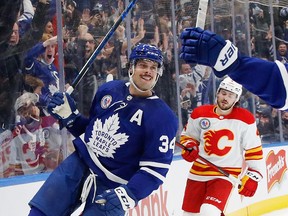 Auston Matthews #34 of the Toronto Maple Leafs scores he game winning goal at 2:32 of overtime against the Calgary Flames at the Scotiabank Arena on November 12, 2021 in Toronto.