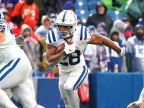 Jonathan Taylor of the Indianapolis Colts runs the ball during the fourth quarter in the game against the Buffalo Bills last week. He scored five touchdowns in the game.