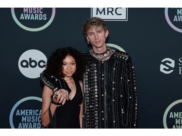 LOS ANGELES, CALIFORNIA - NOVEMBER 21: (L-R) Casie Colson Baker and Machine Gun Kelly attend the 2021 American Music Awards at Microsoft Theater on November 21, 2021 in Los Angeles, California.