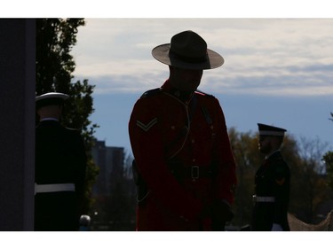 An RCMP offer stands guard during the Remembrance Day ceremonies at the National Military Cemetery at the Beechwood Cemetery in Ottawa, Nov. 11, 2021.