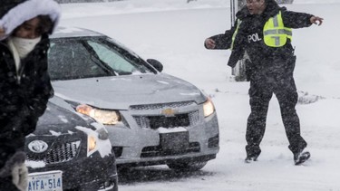 It won't be long before Toronto gets hit by a major storm. A survey found that a majority of Canadians think there should be a law -- like the one in Quebec -- mandating snow tires. This file photo shows a police officer directing traffic on Eglinton Ave. during a 2016 snow storm.