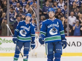 Former Canucks' Daniel (#22) and Henrik Sedin.