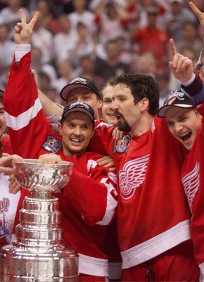 Detroit Red Wings (left to right) captain Steve Yzerman, Brendan Shanahan, and Sergei Fedorov show their joy after beating the Washington Captials 4-1 in Game 4 of the Stanley Cup Finals June 16, 1998 in Washington. THE CANADIAN PRESS/Paul Chiasson