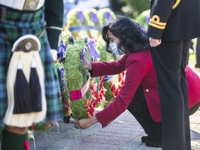 Defence Minister Anita Anand lays a wreath at the cenotaph during a Remembrance Day ceremony at Chris Vokes Memorial Park in Oakville, Ont. on  Nov. 7, 2021.