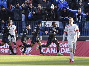 Romell Quioto of CF Montréal runs ahead of the group as he celebrates his goal in the second half against Toronto FC.