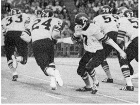 Leon McQuay, 24, takes a handoff from fellow Toronto Argonaut Joe Theismann,7, during their 1971 Grey Cup defeat to the Calgary Stampeders.