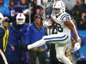 Jonathan Taylor of the Indianapolis Colts runs the ball in the game against the Buffalo Bills.