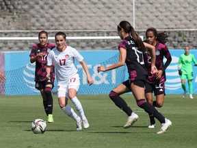 Canadian midfielder Jessie Fleming (No. 17) dribble the ball among opponents in an exhibition game against Mexico in Mexico City on Nov. 27, 2021. Canada and Mexico will play again Tuesday.
