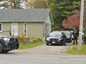 OPP officers are pictured outside the home of Norfolk gunsmith Rodger Kotanko, 70, on Nov. 4, 2021. The SIU is investigating after Toronto Police shot and killed Kotanko.