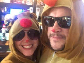 Steve and Rebecca Eccles, owners of The Saddle Inn, dressed up in reindeer costumes.