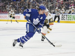 Maple Leafs forward Auston Matthews carries the puck past Vegas Golden Knights forward Mattias Janmark  during the first period at Scotiabank Arena on Tuesday night.