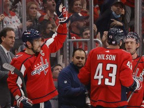 Washington Capitals left wing Alex Ovechkin (8) waves to fans while being acknowledged for tying Brett Hull for 4th place in all-time NHL goals scored after a goal against the Buffalo Sabres during the second period at Capital One Arena Nov. 8, 2021.