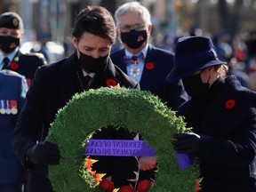 Canada's Prime Minister Justin Trudeau and his wife Sophie Gregoire lay a wreath during a ceremony at the National War Memorial on Remembrance Day in Ottawa.