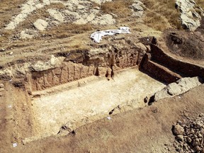 An undated handout picture provided by Terra Di Ninive on Oct. 24, 2021, shows a view of carvings discovered on the walls of an ancient irrigation canal by a team of Kurdish and Italian archaeologists near Faydeh in the Nineveh area of northern Iraq.