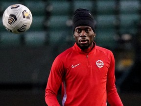 Team Canada's Alphonso Davies keeps an eye on the ball during a team practice at Commonwealth Stadium in Edmonton on Sunday November 14, 2021, in preparation for their FIFA 2022 World Cup qualifier soccer match against Team Mexico on Tuesday November 16, 2021.