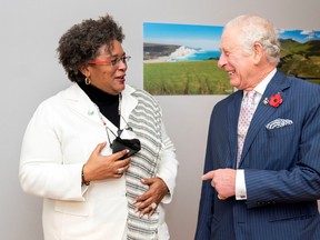 Charles, Prince of Wales, greets Barbados' Prime Minister Mia Amor Mottley ahead of their bilateral meeting on the sidelines of the UN Climate Change Conference (COP26) in Glasgow, Scotland on November 1, 2021.