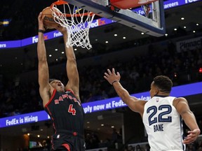 Toronto Raptors forward Scottie Barnes (4) dunks as Memphis Grizzles guard Desmond Bane (22) defends during the first half at FedExForum.