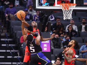 Toronto Raptors forward-centre Chris Boucher (25) blocks the shot by Sacramento Kings guard De'Aaron Fox (5) during the first quarter at Golden 1 Center.