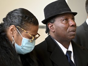 Anthony Broadwater, right, gazes upward, Monday, Nov. 22, 2021, in Syracuse, N.Y., after Judge Gordon Cuffy overturned the 40-year-old rape conviction that wrongfully put him in state prison for Alice Sebold's rape.