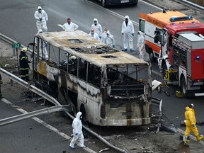 Officials work at the site of a bus accident on a highway near the village of Bosnek, south of Sofia, on Nov. 23, 2021.