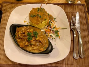 Curried conch served with fungee, a specialty at Beachlimerz restaurant. EDDIE CHAU