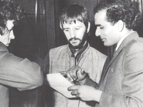 Suresh Joshi, right, meets with engineer John Brahn, left, and Ringo Starr in 1968 in Liverpool, in this undated handout photo obtained by Reuters on Wednesday, Nov. 10, 2021.