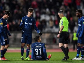 Belenenses' goalkeeper Joao Monteiro sits on the pitch at the end of the the Portuguese league match between Belenenses SAD and SL Benfica at the Jamor stadium in Oeiras, Portugal, Nov. 27, 2021.