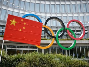 A Chinese flag flutters in front of the IOC headquarters during a protest by activists of the International Tibet Network against the Beijing 2022 Winter Olympics on Feb. 3, 2021 in Lausanne,  Switzerland.