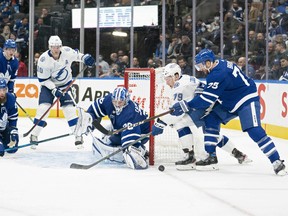 Maple Leafs' defenseman T.J. Brodie (78) and Tampa Bay Lightning's Ross Colton (79) battle for the puck during the second period at Scotiabank Arena on Thursday, Nov. 4, 2021.