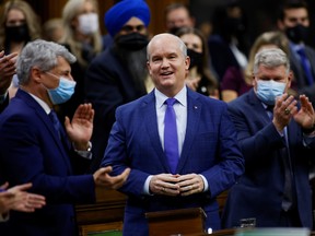 Conservative Party Leader Erin O'Toole smiles in the House of Commons on Parliament Hill following the Throne Speech in Ottawa November 23, 2021.