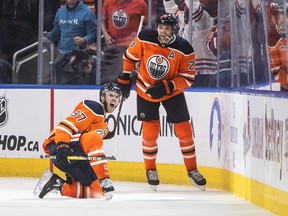 Edmonton Oilers' Connor McDavid (left) and Leon Draisaitl celebrate a goal against the New York Rangers in Edmonton on Friday, Nov. 5, 2021.