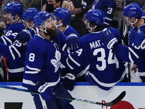 Toronto Maple Leafs defenceman Jake Muzzin (8) celebrates his goal against the Detroit Red Wings during first period NHL hockey action in Toronto on Saturday, October 30, 2021.