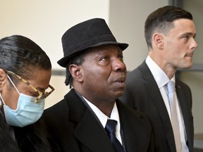 Anthony Broadwater, centre, gazes upward, Monday, Nov. 22, 2021, in Syracuse, N.Y., after Judge Gordon Cuffy overturned the 40-year-old rape conviction that wrongfully put him in state prison for Alice Sebold's rape.