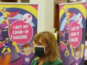 Ontario Health Minister Christine Elliott on hand as children who are part of the Hospital for Sick Children family between the ages of 5 and 11 are the first to get vaccinated for COVID-19 at the Metro Toronto Convention Centre, in Toronto, Tuesday, Nov. 23, 2021.